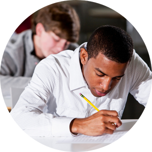 teen boys using pencil on paper